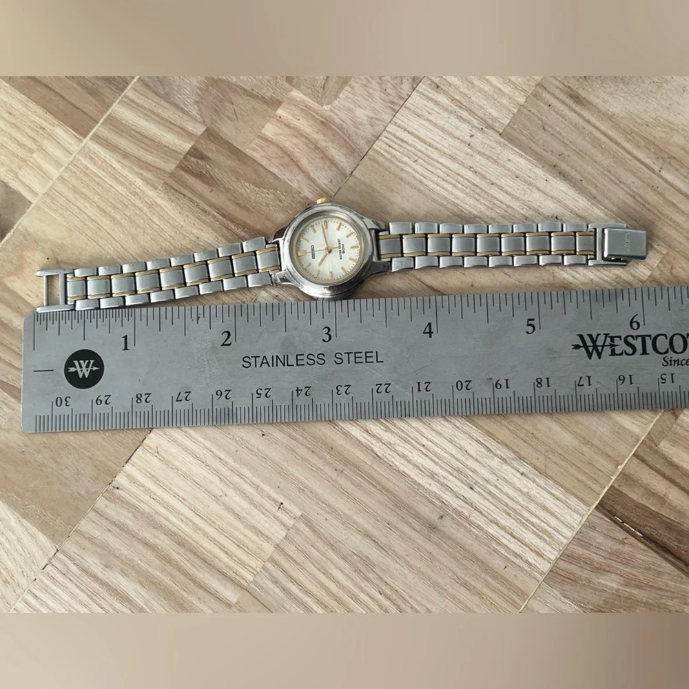 Seiko Ladies Watch Spiral Stainless Dial Gold-Tone Markers Two-Tone Bracelet